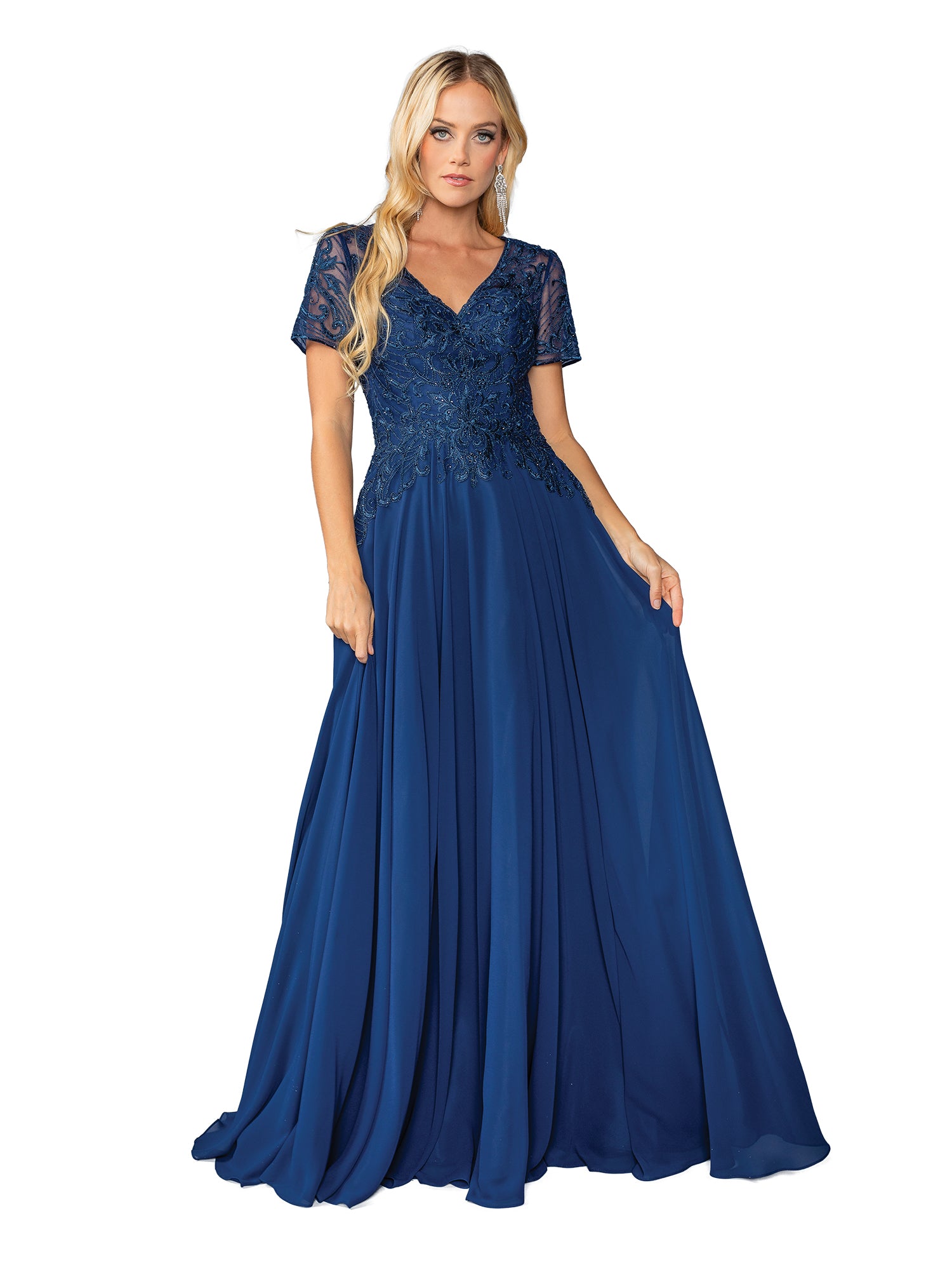 A woman in the Dancing Queen 4445 short-sleeve long formal dress, featuring an embroidered-lace bodice and floor-length royal blue skirt, stands against a white background.